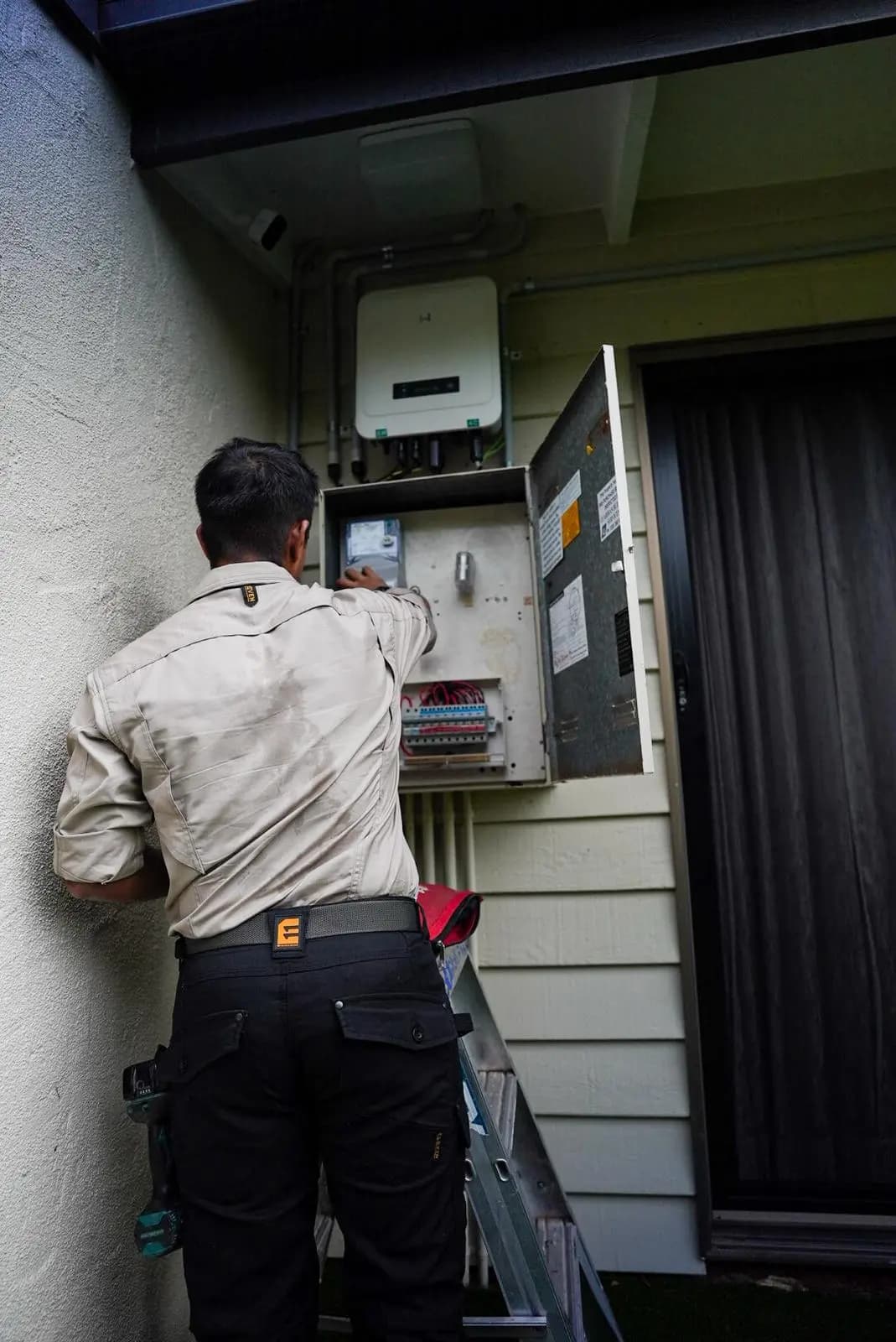 Electrician installing lighting in a residential home